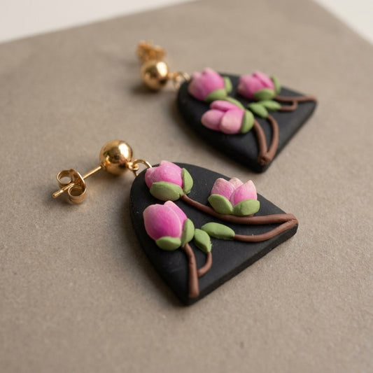 Magnolia handmade polymer-clay earrings, close-up detail of one earring