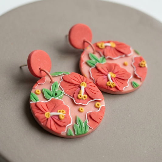 Hibiscus handmade polymer-clay earrings, close-up detail of one earring