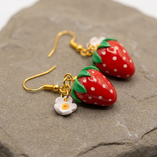 Strawberries handmade polymer-clay earrings, close-up detail of one earring