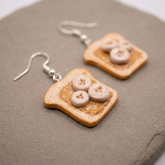 Peanut Butter and Banana earrings handmade polymer-clay earrings, close-up detail of one earring