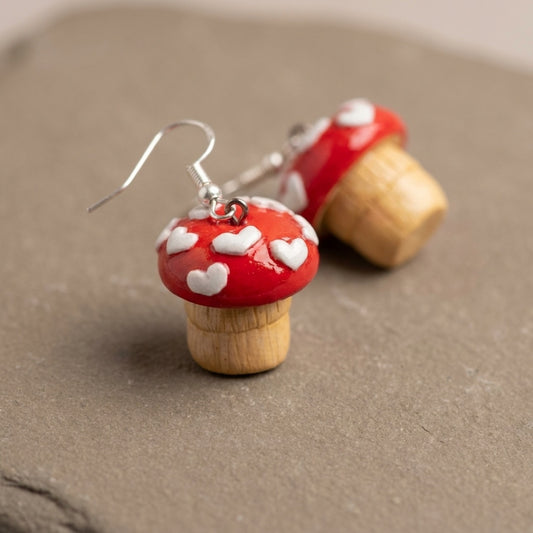 Shroom hearts handmade polymer-clay earrings, close-up detail of one earring