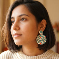 Teal Forest handmade polymer-clay earrings, worn on the ear
