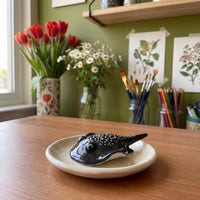 Stinger Ray handmade glossy clay desk pal, styled in the Moon Kiln studio, daytime