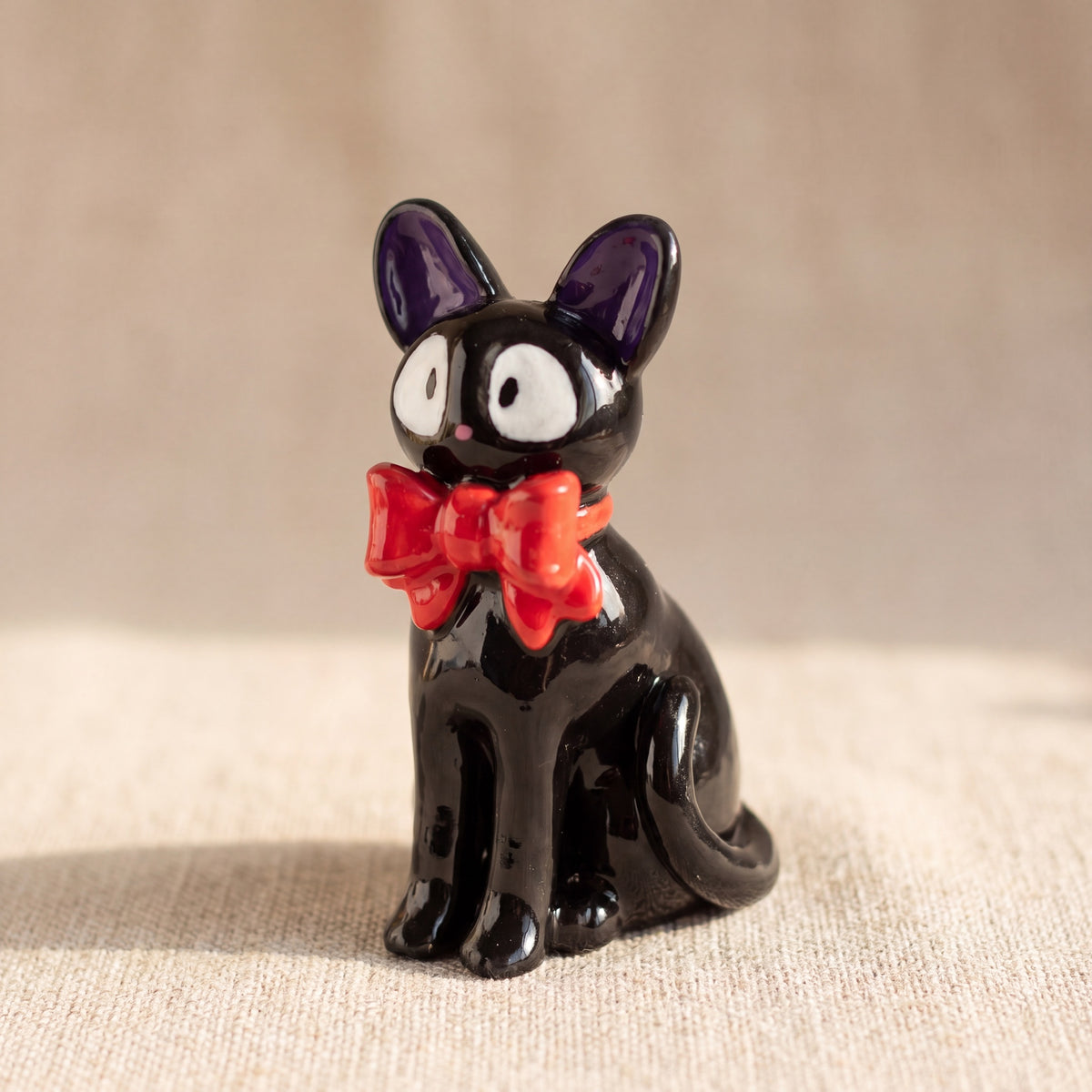 Midnight Cat handmade glossy clay desk pal, front view