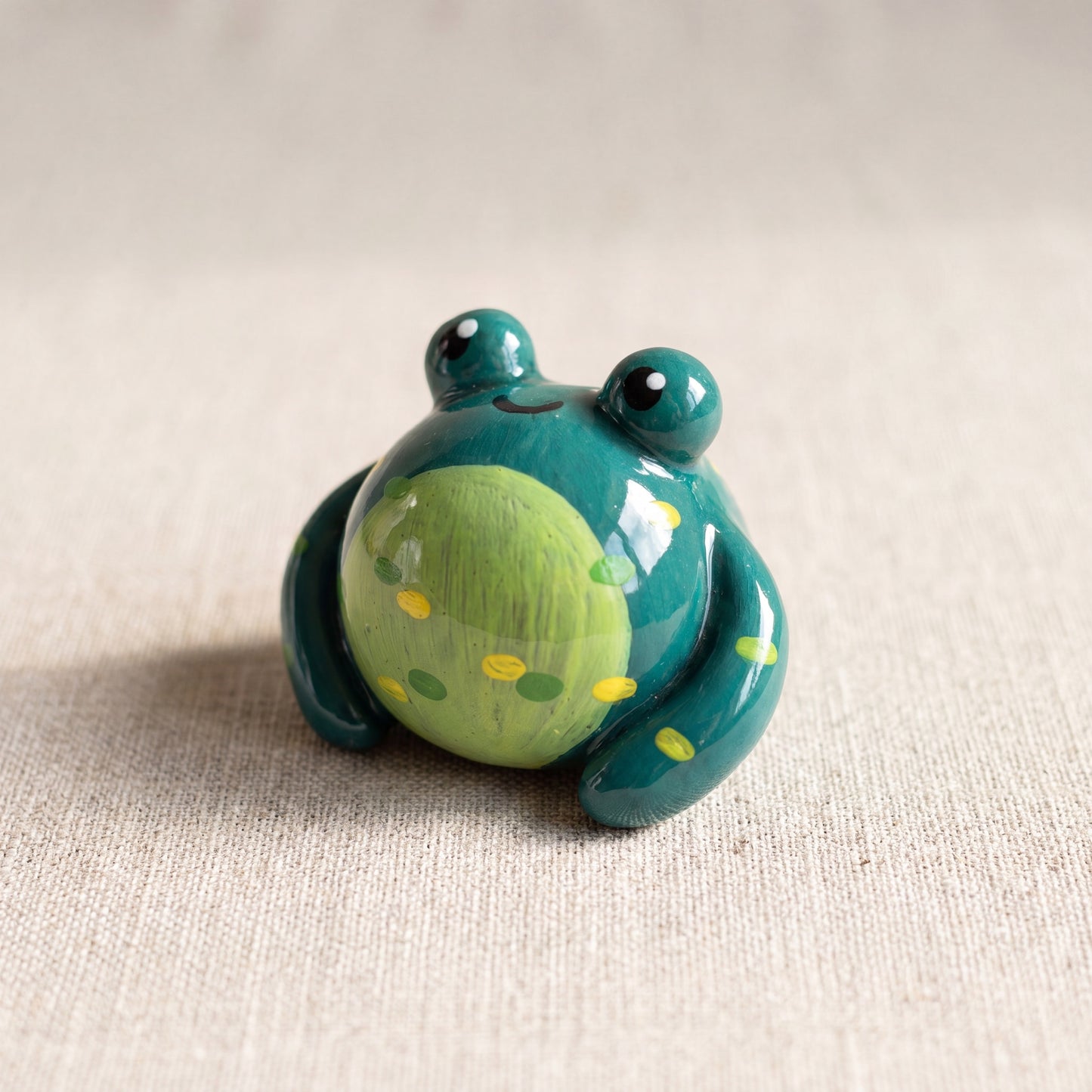 Mr. Ribbit handmade glossy clay desk pal, front view