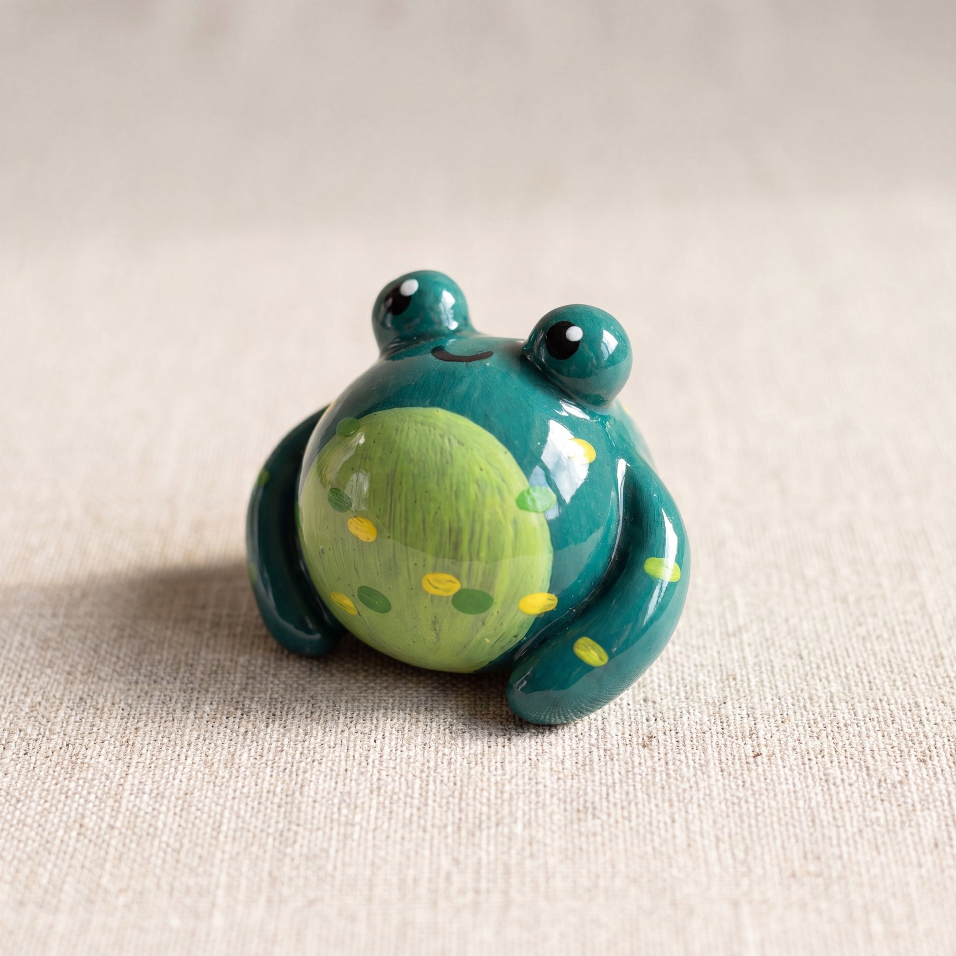 Mr. Ribbit handmade glossy clay desk pal, front view