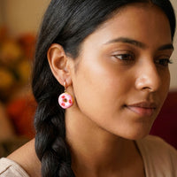 Donut Hearts handmade polymer-clay earrings, worn on the ear