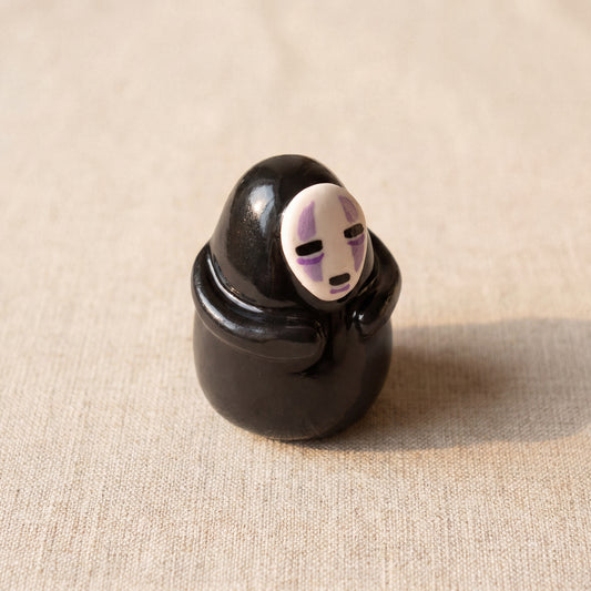 Masked Spirit handmade glossy clay desk pal, isometric view