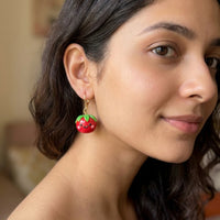Tomatoes handmade polymer-clay earrings, worn on the ear