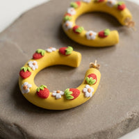 Strawberry Hoops handmade polymer-clay earrings, close-up detail of one earring