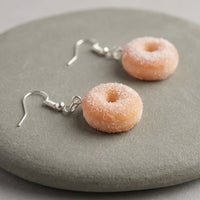 Sugar Donuts handmade polymer-clay earrings, close-up detail of one earring