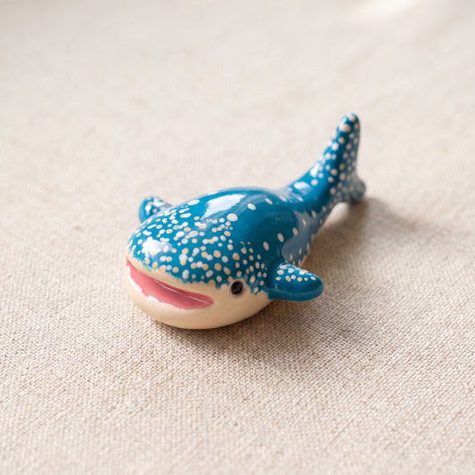 Happy Whale handmade glossy clay desk pal, isometric view