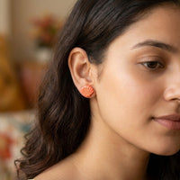 Seashell Studs handmade polymer-clay earrings, worn on the ear