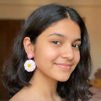 Daisy Lover handmade polymer-clay earrings, worn on the ear
