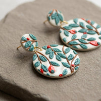 Teal Forest handmade polymer-clay earrings, close-up detail of one earring