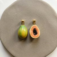 Papaya! handmade polymer-clay earrings, the pair on a warm stone surface