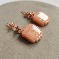 Cordelia’s Blush handmade polymer-clay earrings, close-up detail of one earring