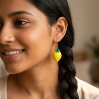 Lemonita handmade polymer-clay earrings, worn on the ear