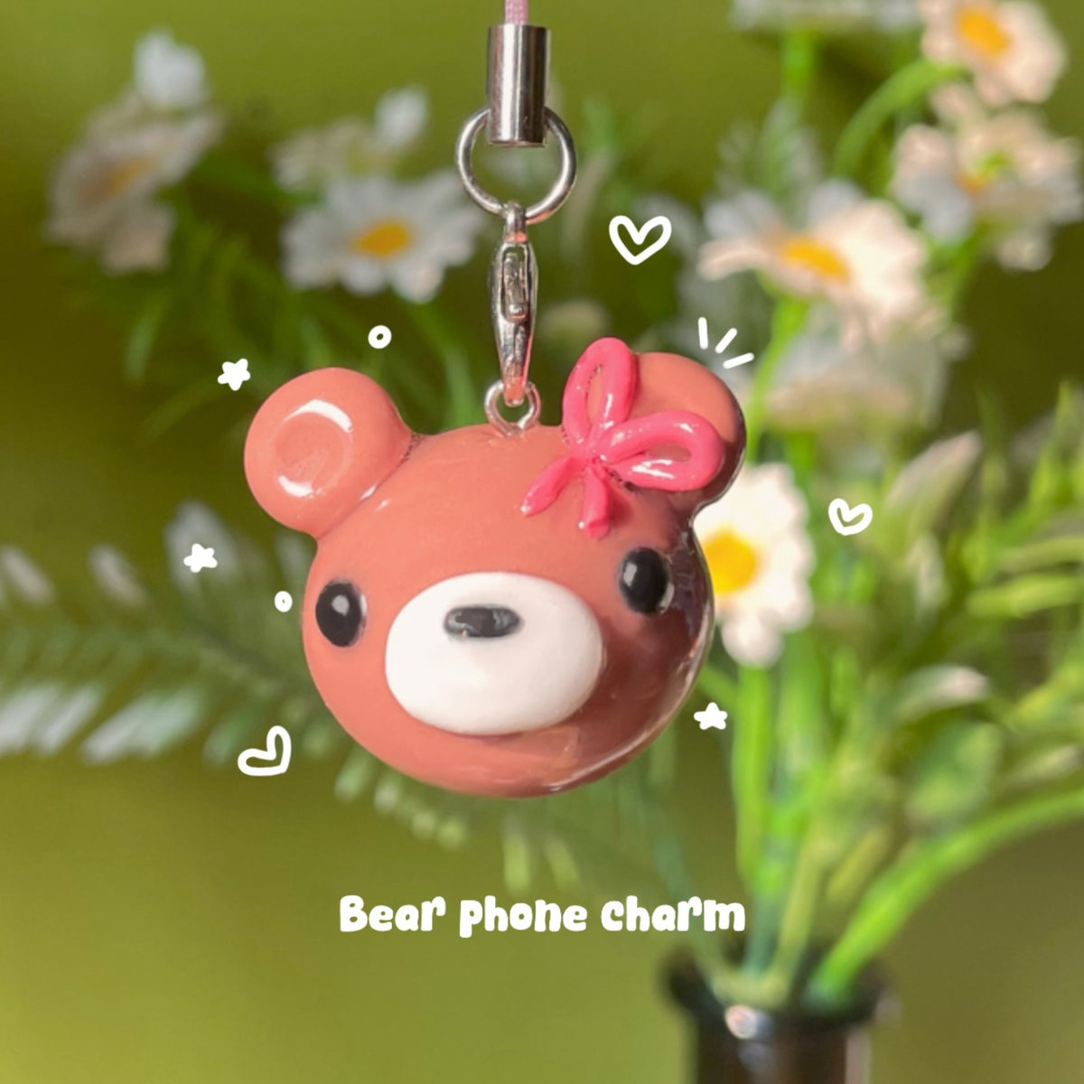 Bear Charm handmade polymer clay phone charm, rosy brown bear head with pink ribbon bow and glossy finish, on silver clasp cord