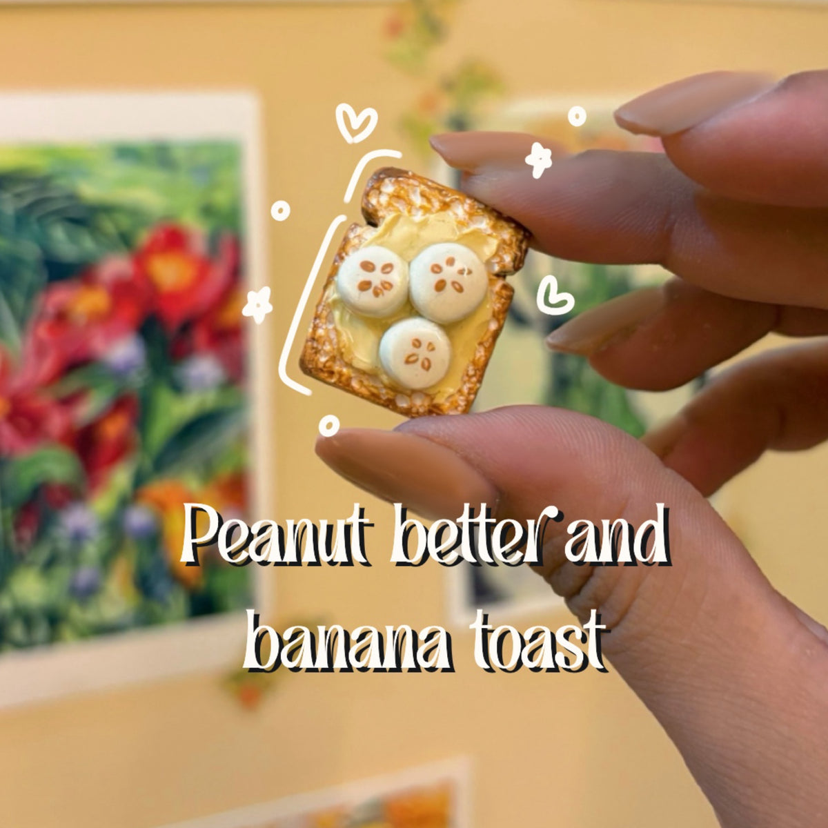 Peanut butter and banana toast handmade polymer clay keychain, miniature toast with peanut butter and banana slices, held between fingers