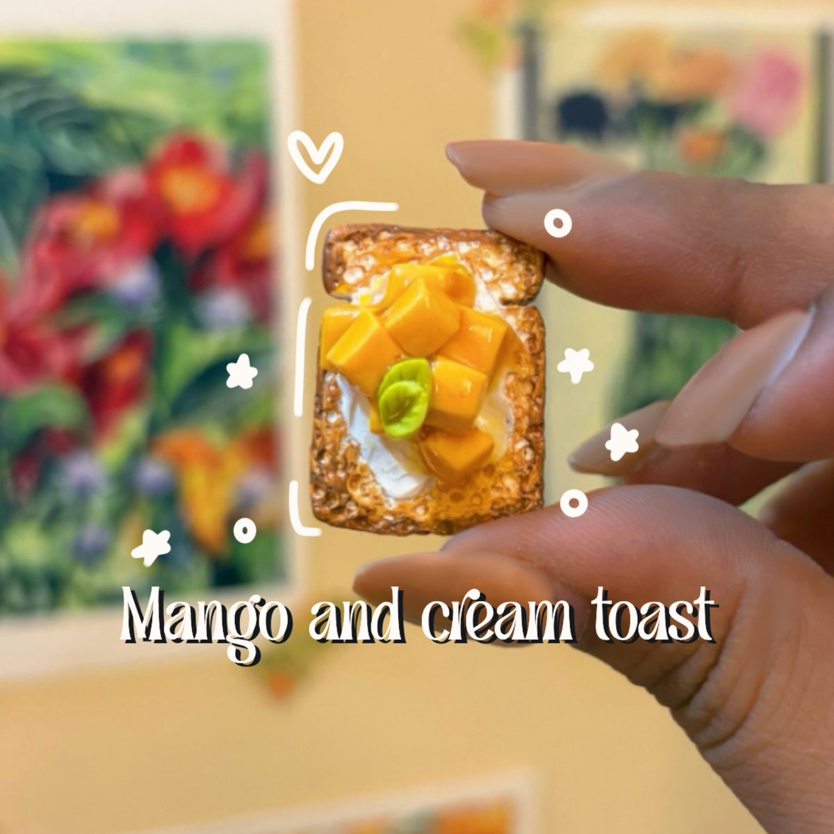 Mango and cream toast handmade polymer clay keychain, miniature toast slice with cream and yellow mango cubes, held between fingers