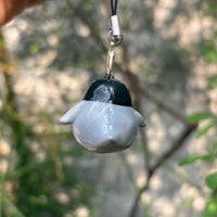 Baby Penguin polymer clay charm, close-up showing chubby penguin with black and white markings and tiny flippers
