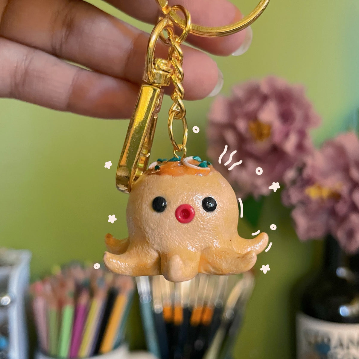 Takoyaki handmade polymer clay keychain, cute octopus ball character with toppings and red nose, glossy finish on gold ring
