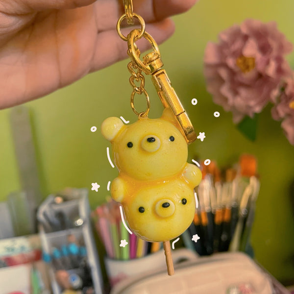 Candy Bear handmade polymer clay keychain, glossy yellow bear skewer figure with two stacked bear bodies on a stick, gold clasp