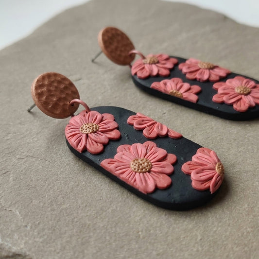 Cherry Blossoms handmade polymer-clay earrings, close-up detail of one earring