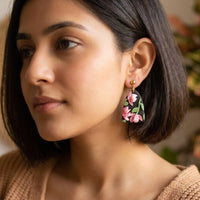 Roseate Drops handmade polymer-clay earrings, worn on the ear