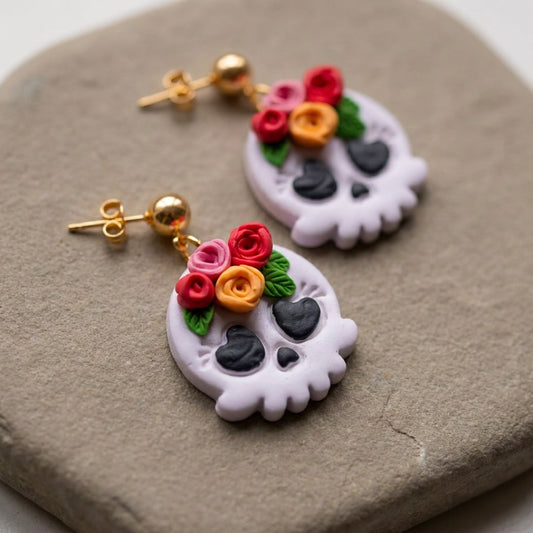 Skull and Flora handmade polymer-clay earrings, close-up detail of one earring