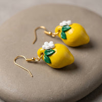 Lemonita handmade polymer-clay earrings, close-up detail of one earring