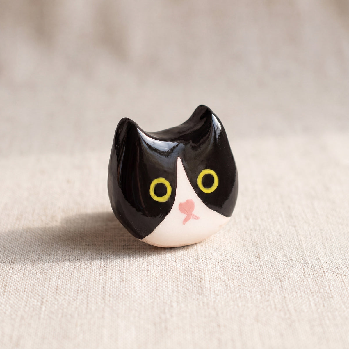 Charlie handmade glossy clay desk pal, front view