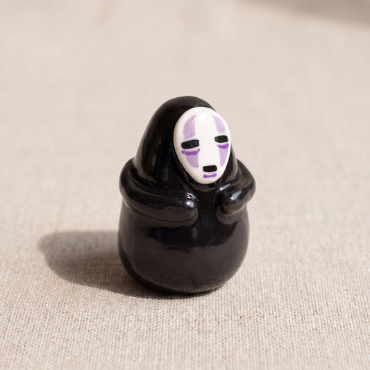 Masked Spirit handmade glossy clay desk pal, front view