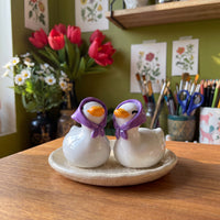 Happy Duck handmade glossy clay desk pal, styled in the Moon Kiln studio, daytime